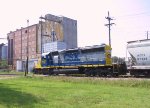 CSX 8107 leads a short train thru town